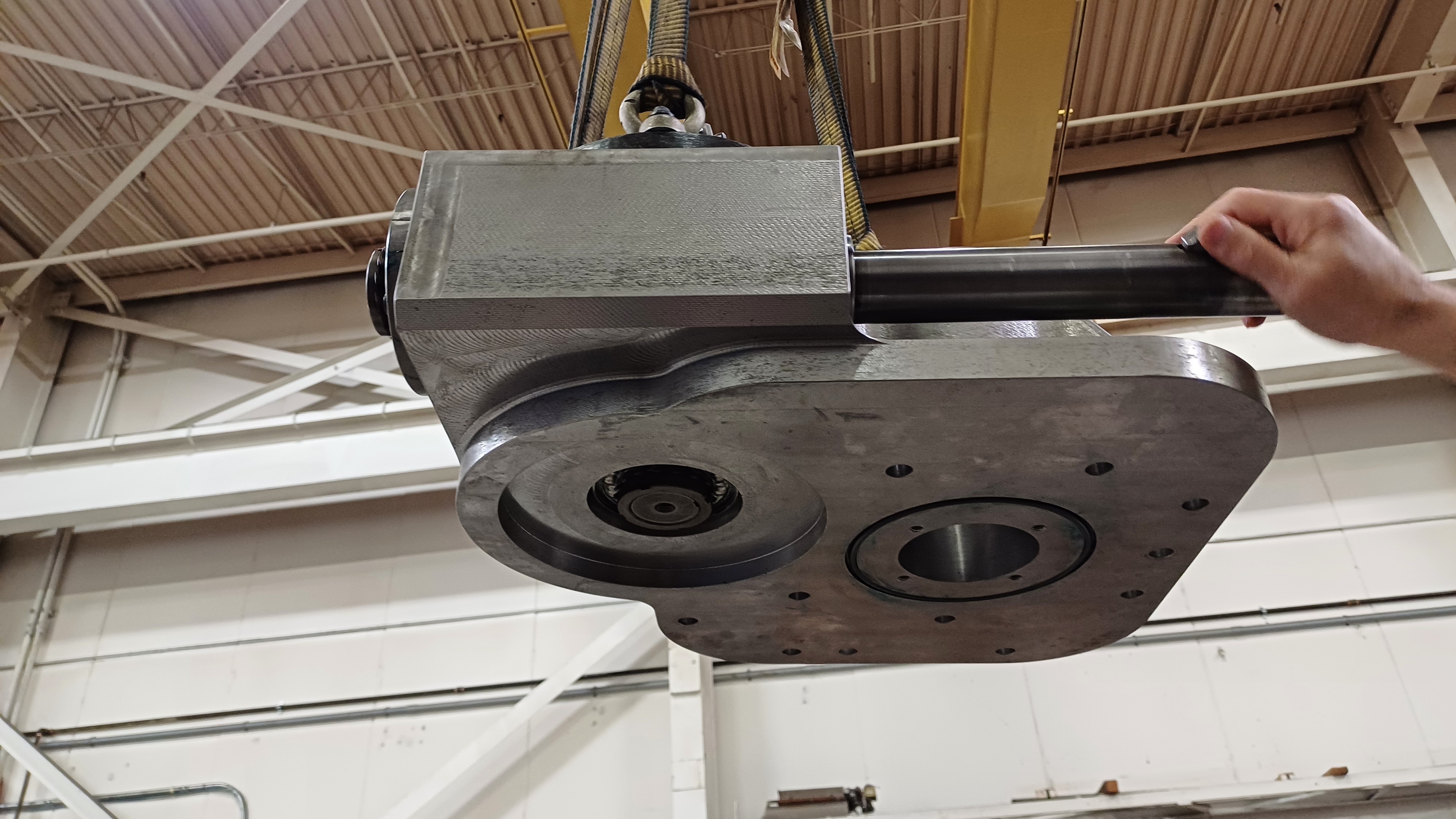 Machinist showing rotation of new gear